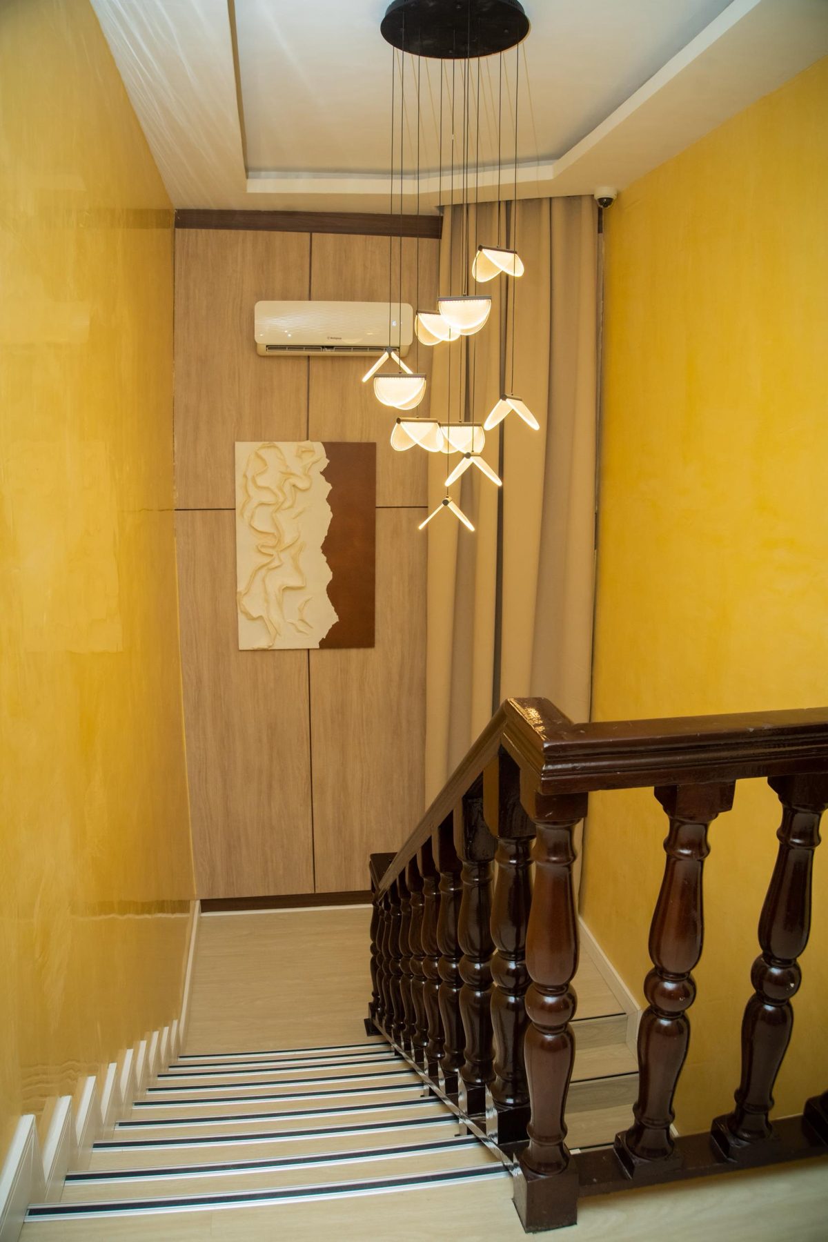 Feature staircase and pendant lighting at LeSam Hotels and Suites, Port Harcourt