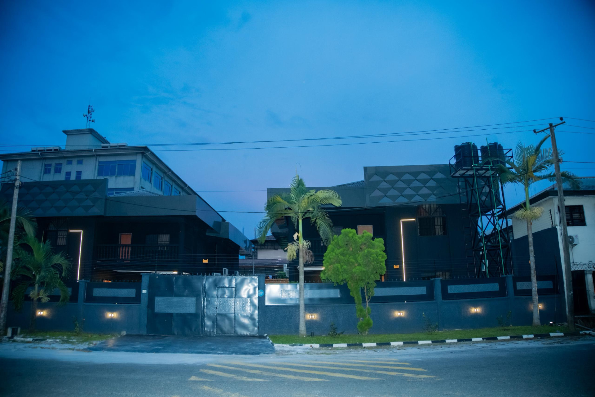 LeSam Hotels and Suites exterior at dusk, No. 30 Apara Road, GRA Phase 2, Port Harcourt